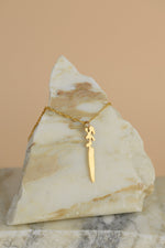 Load image into Gallery viewer, Landmass shaped Dagger sits on a triangle shaped piece of marble
