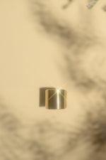Load image into Gallery viewer, Gold saddle ring in a cream background

