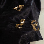Load image into Gallery viewer, Gold toned landmass shaped ring on black velvet
